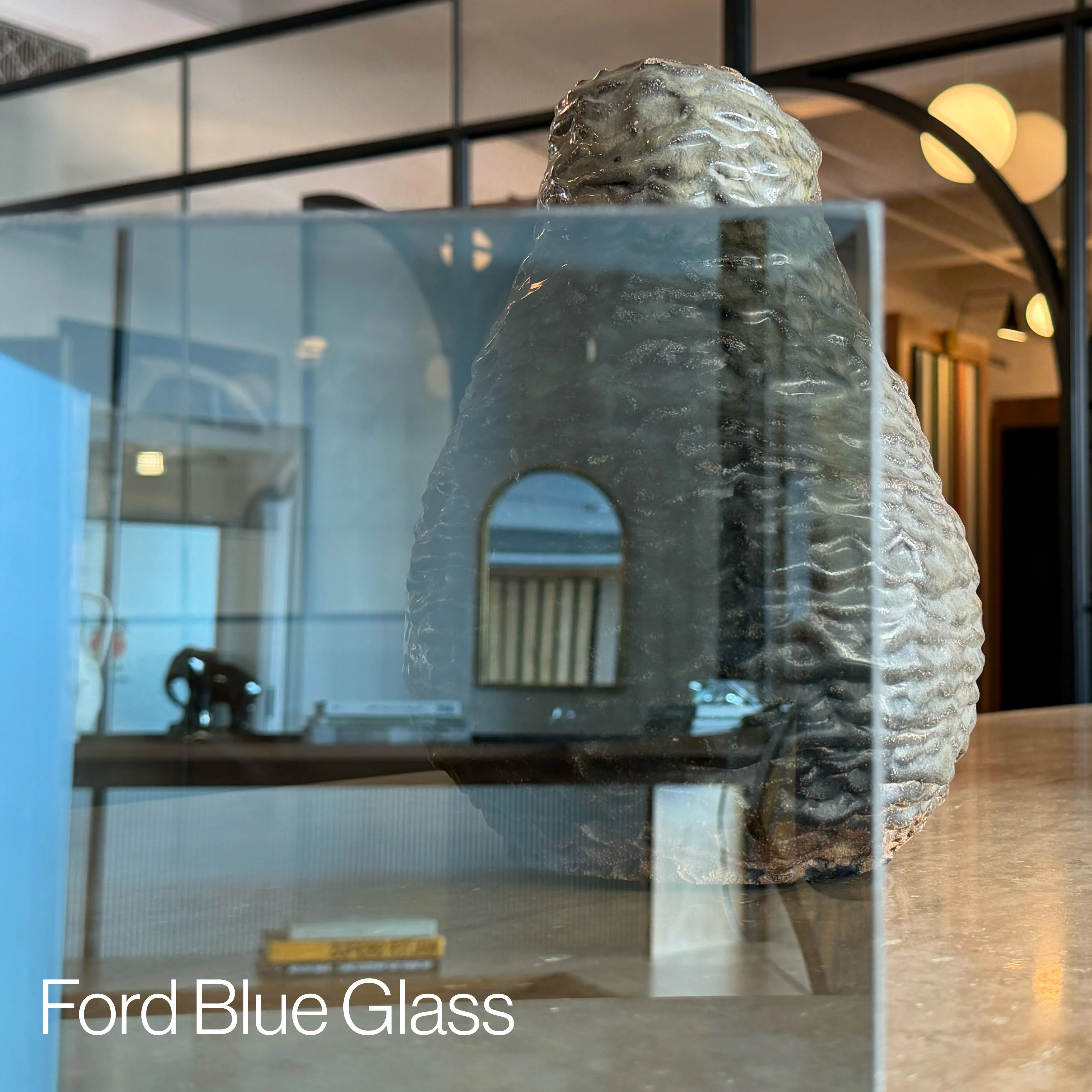 Reflective ford blue glass pane sample.