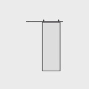 Modern Air Lite interior barn door with slim profile steel construction and clear glass, design-forward sliding door