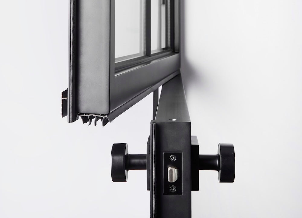 single black contemporary dutch door with independently operable dutch panel