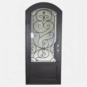 Single entryway door with a thick steel and iron frame, a large window behind an intricate iron pattern, a slight arch on top, and a solid bottom panel. Door is thermally broken to protect from extreme weather.