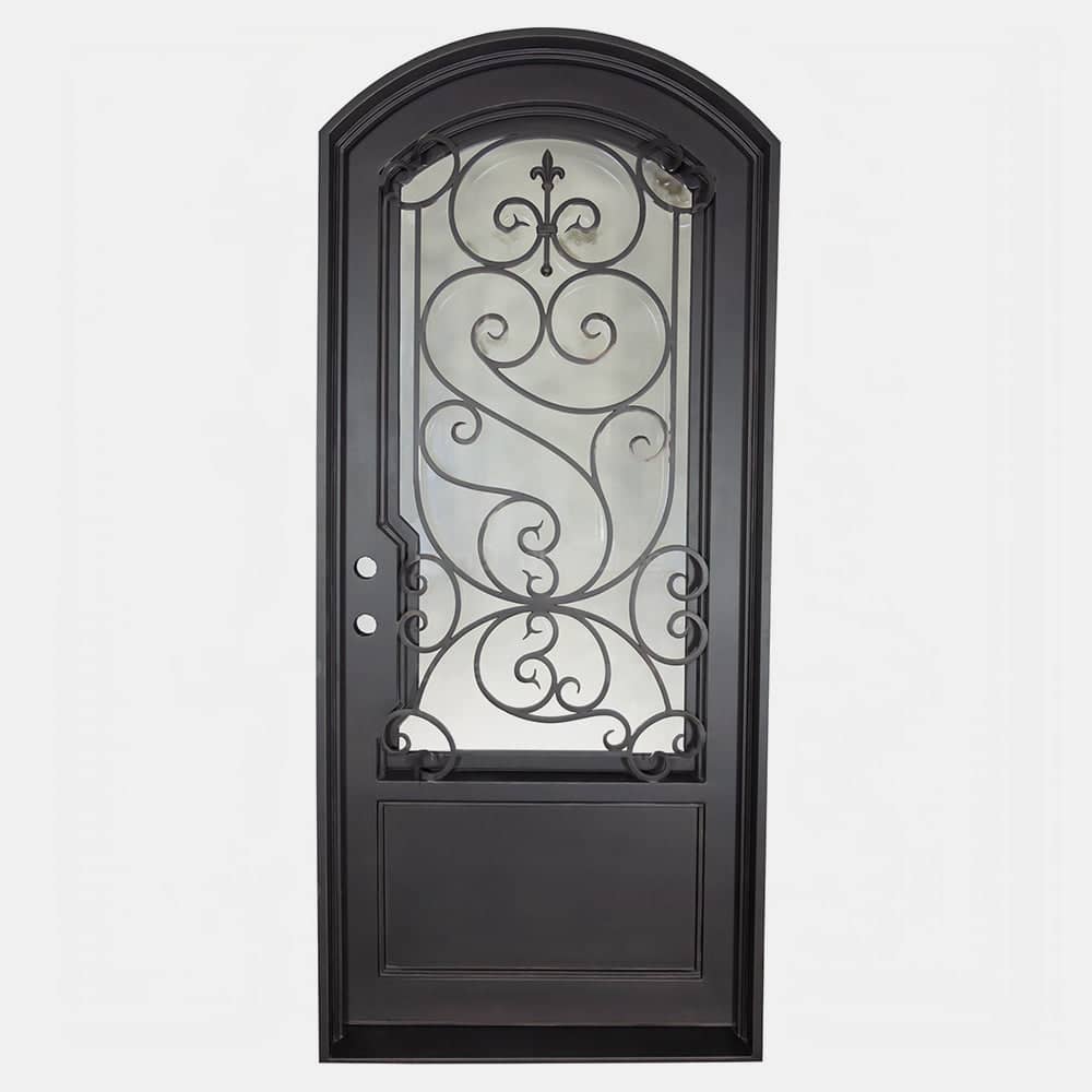 Single entryway door with a thick steel and iron frame, a large window behind an intricate iron pattern, a slight arch on top, and a solid bottom panel. Door is thermally broken to protect from extreme weather.