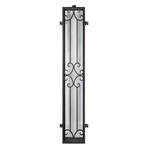Sidelight window to accompany an entryway front door. Window has iron detailing and tabs to place screws to secure. Window is thermally broken to protect from extreme heat.