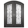 Double entryway doors with a thick iron frame, a slight arch and a full panel of glass behind an intricate iron design.