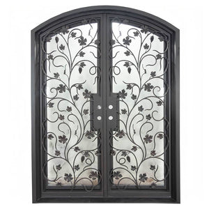 Double entryway doors made with a thick iron and steel frame, a single full pane of glass behind an intricate iron design on each door, and a slight arch on top. Door is thermally broken to protect from extreme weather.