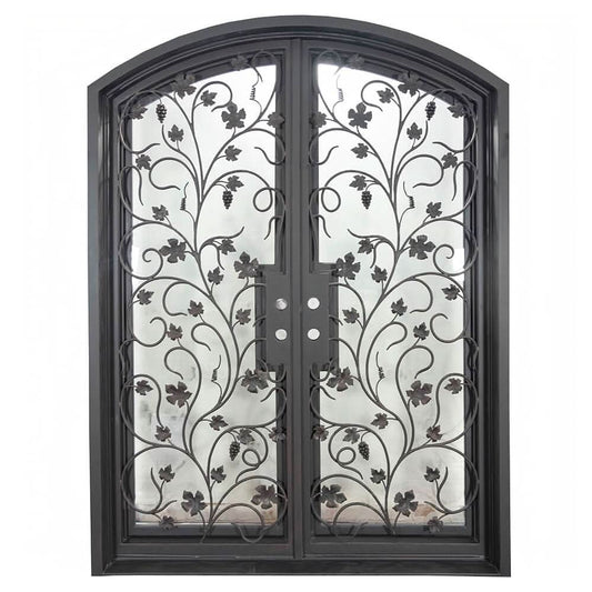 Double entryway doors made with a thick iron and steel frame, a single full pane of glass behind an intricate iron design on each door, and a slight arch on top. 
