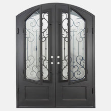 Load image into Gallery viewer, Double entryway doors made with a thick steel and iron frame. Doors have a slight arch and a 3/4 panel of glass behind an intricate iron design. Doors are thermally broken to protect from extreme weather.