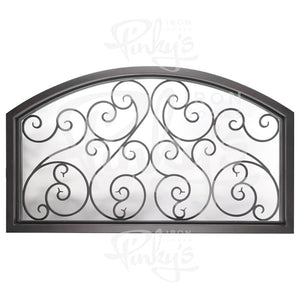 Large slightly arched transom window behind an intricate iron pattern. Window is thermally broken to protect from extreme weather.