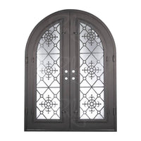 Double entryway doors with full panes of glass behind intricate iron detailing. Doors feature a full arch and are thermally broken to protect from extreme weather.