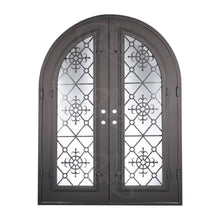 Load image into Gallery viewer, Double entryway doors with full panes of glass behind intricate iron detailing. Doors feature a full arch and are thermally broken to protect from extreme weather.