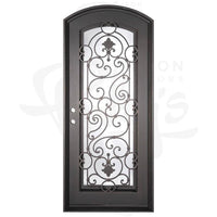 Single entryway door with full length pane of glass behind intricate iron detailing. Door features a slight arch and is thermally broken to protect from extreme weather.