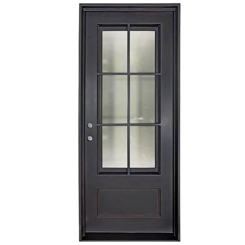 Single entryway door with a thick iron and steel frame and a full pane of glass behind intricate iron detailing.