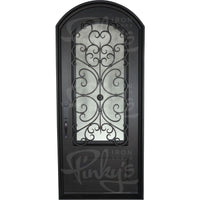 Double entryway doors with a thick iron and steel frame and a full pane of glass behind intricate iron detailing.