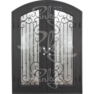 Double entryway doors with a thick iron and steel frame and a full pane of glass behind intricate iron detailing.