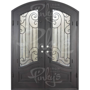 Double entryway doors with a thick iron and steel frame and a full pane of glass behind intricate iron detailing.
