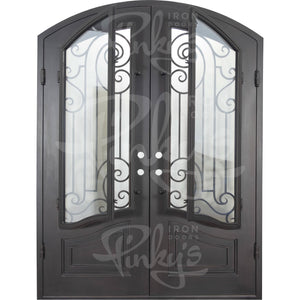 Double entryway doors with a thick iron and steel frame and a full pane of glass behind intricate iron detailing.