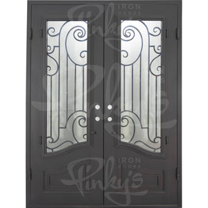 Double entryway doors with a thick iron and steel frame and a full pane of glass behind intricate iron detailing.