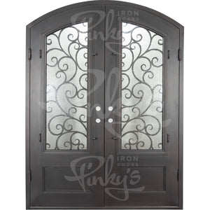 Double entryway doors made with a thick iron and steel frame. Doors feature 3/4 panel windows behind intricate iron detailing, a kickplate, and a slight arch on top. Doors are thermally broken to protect from extreme weather.