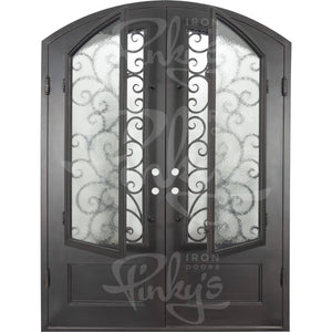 Double entryway doors made with a thick iron and steel frame. Doors feature 3/4 panel windows behind intricate iron detailing, a kickplate, and a slight arch on top. Doors are thermally broken to protect from extreme weather.